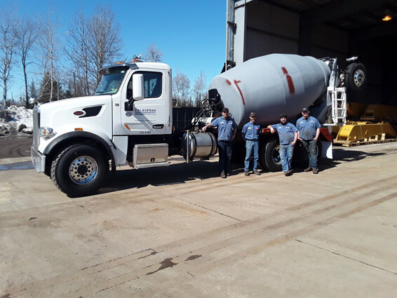 Photo of Assemblers by a cement truck